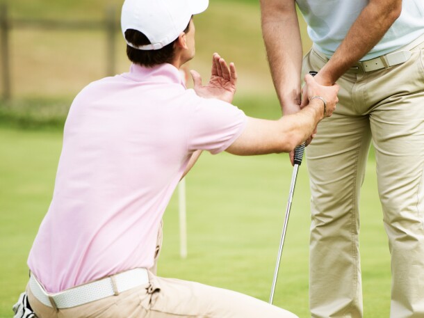 Instructor giving lessons at golf course