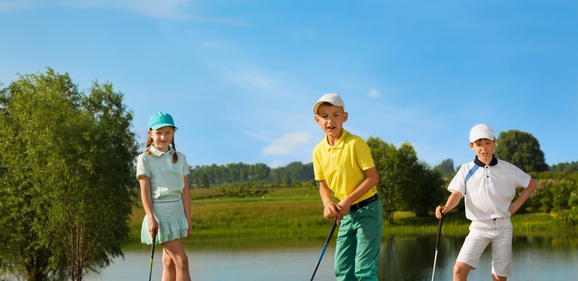 Junior Golfers On Golf Course